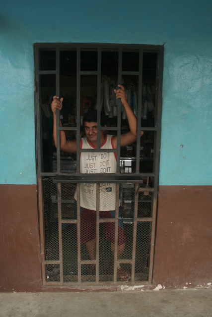 A typical shop, the owner barricades himself behind bars.