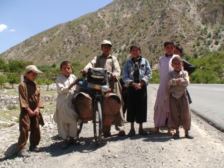 Afghan kids helping out after Rob wipes out.