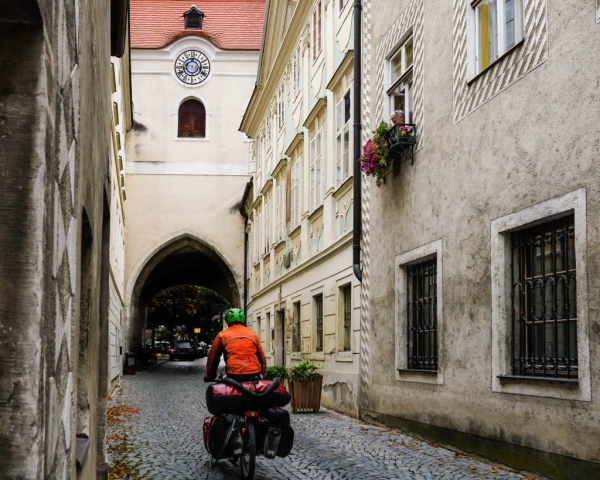 cycling in village with cobbled streets