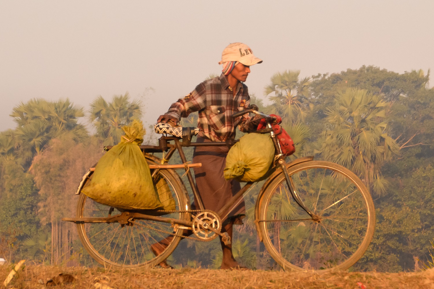 Man with bicycle in Myanmar
