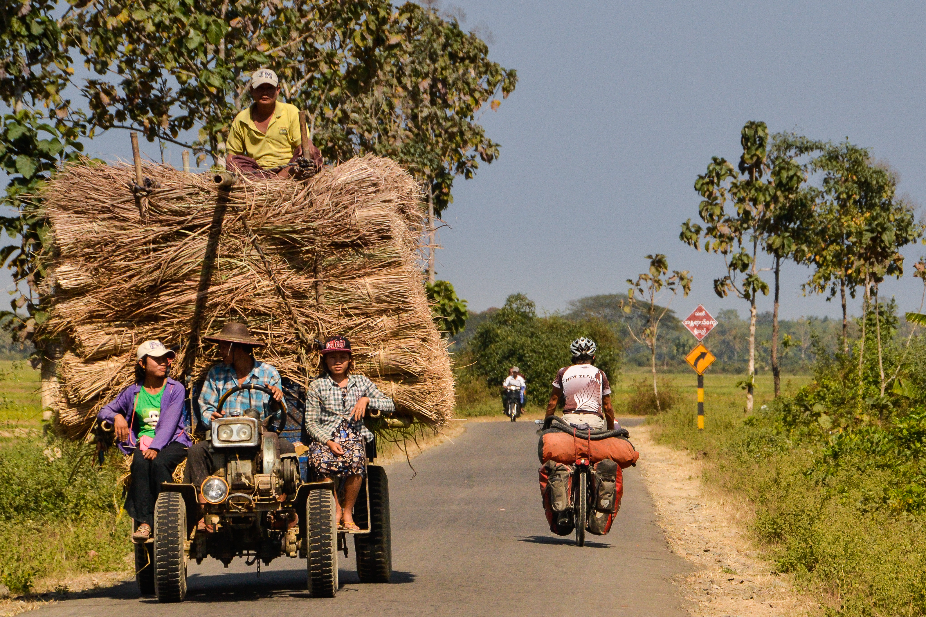 tractor and cyclist in Myanmar